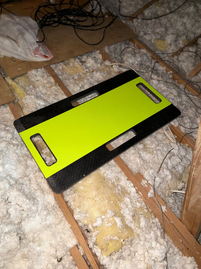 an attic walk board placed safely between attic joists